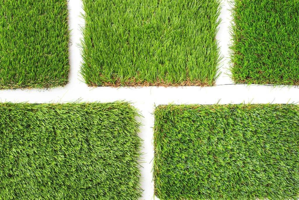 Detail of types of artificial grass in a sample book.